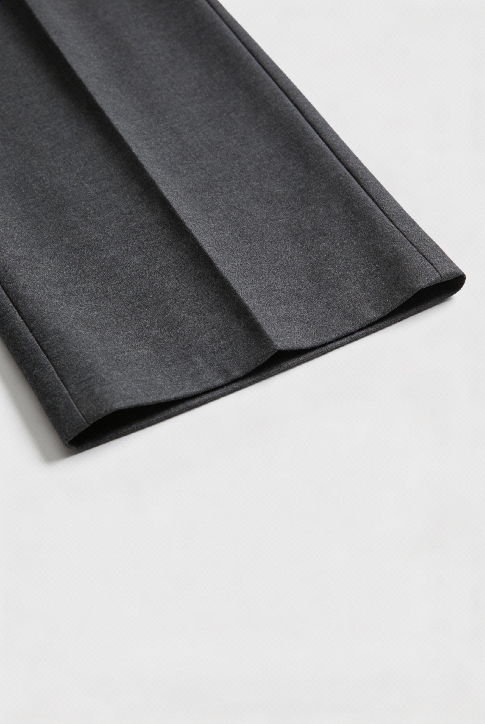 Victoria Lumina gray high-waisted tailored trousers with elegant draping, showcasing a sleek fit and sophisticated style.