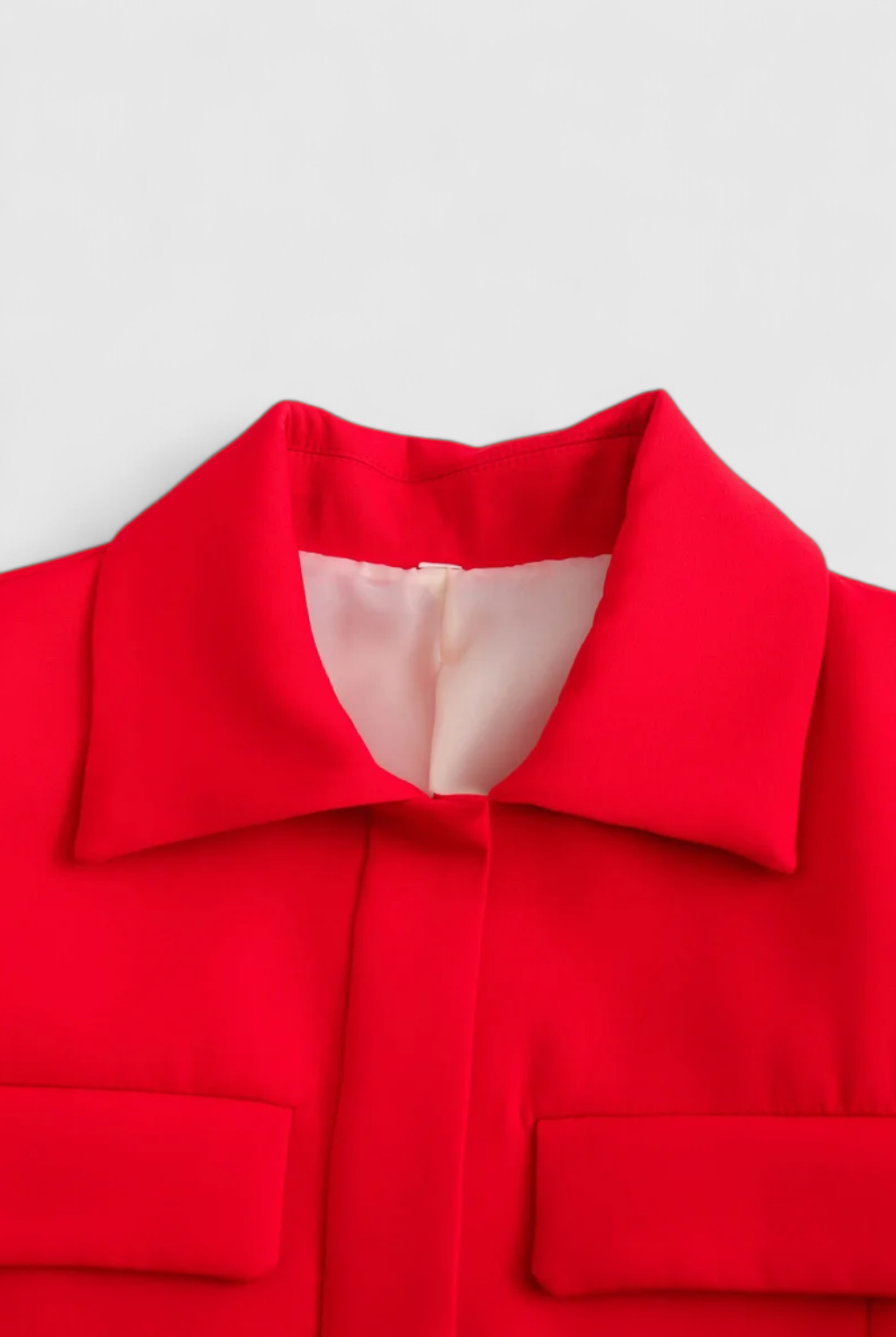 Red women's cropped button jacket from Lumina Wear with a trendy, flattering fit, perfect for stylish casual wear.