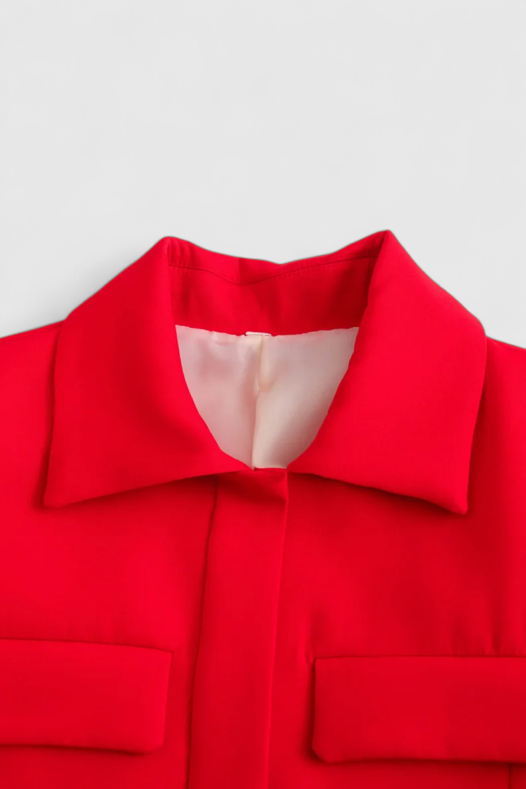 Red women's cropped button jacket from Lumina Wear with a trendy, flattering fit, perfect for stylish casual wear.