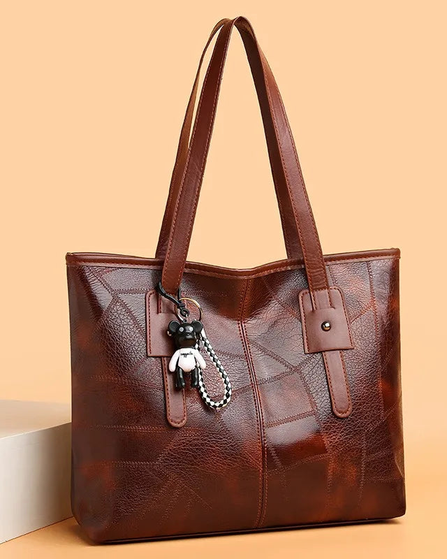 Lumina Wear Victoria vintage-inspired spacious tote bag in khaki with keychain accent, stylish handbag for everyday use.