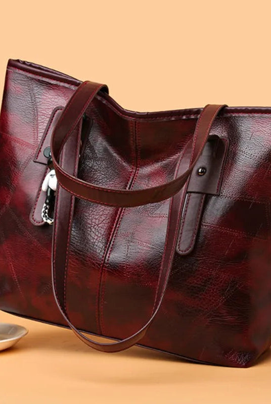 Lumina Wear Victoria vintage-inspired spacious tote bag in khaki with keychain accent and sturdy handles.