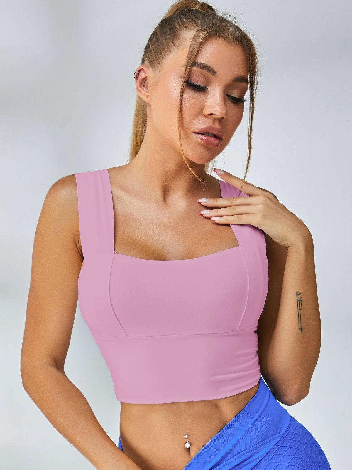 White Lumina Vancouver sports bra with wide shoulder straps, designed for comfort and support during athletic activities.
