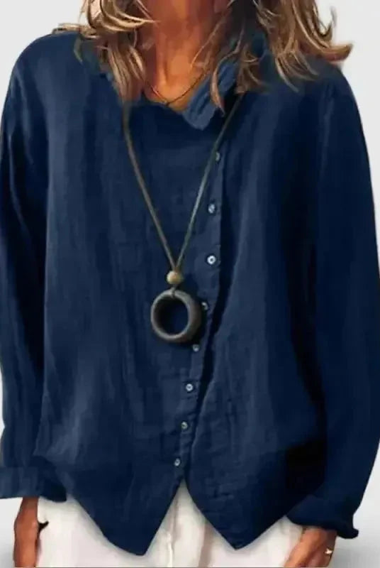 Woman wearing a dark blue cotton casual long shirt by Lumina Wear, perfect for everyday comfort and style.