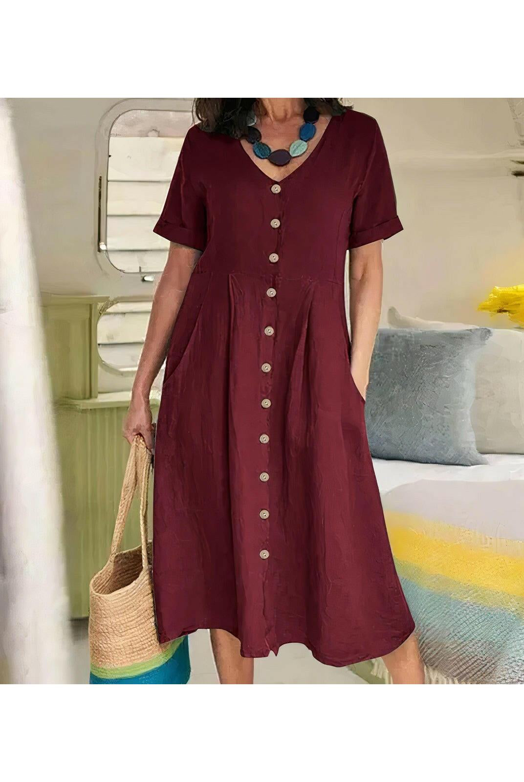 White Yasmin™ buttoned dress by Lumina Wear, stylish and effortless, shown on a model with a relaxed fit and elegant design.