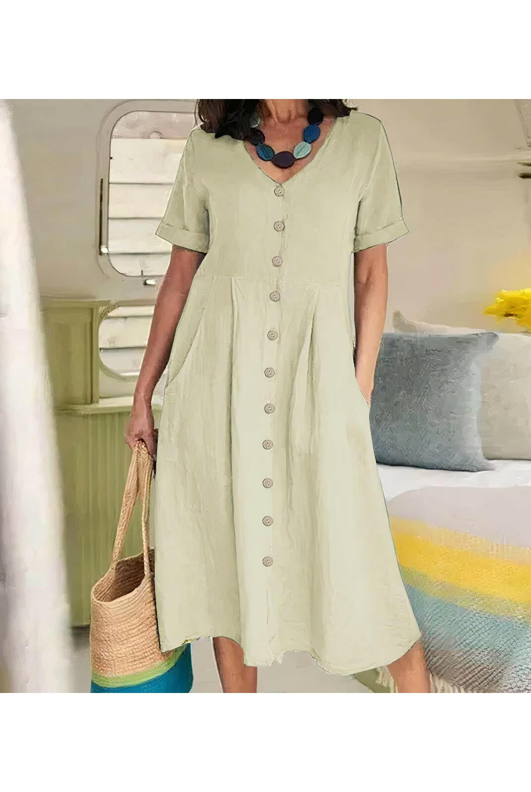 White Yasmin™ Effortless Buttoned Dress by Lumina Wear, styled on a mannequin, perfect for casual or semi-formal occasions.