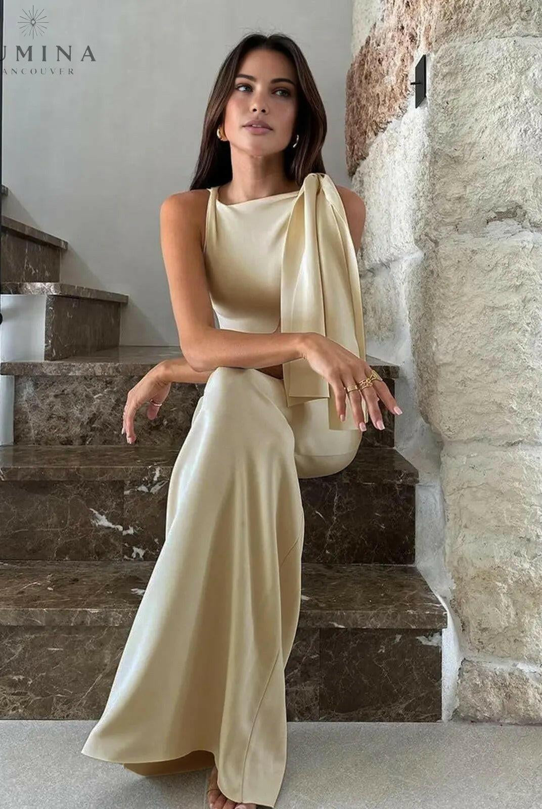 Off-white Yasmine knotted maxi dress by Lumina Wear, flowing fabric and elegant design, displayed on a model.