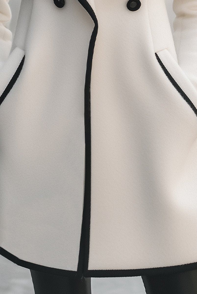 Lumina Wear Briony double-breasted white coat with trim, stylish outerwear for women, front view with buttons and collar.