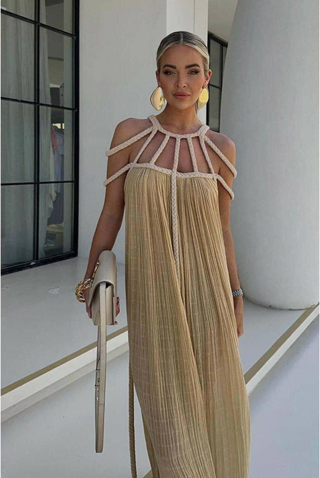 Beige Zeeva elegant stylish dress by Lumina Wear, featuring a modern design, displayed on a hanger against a neutral background.