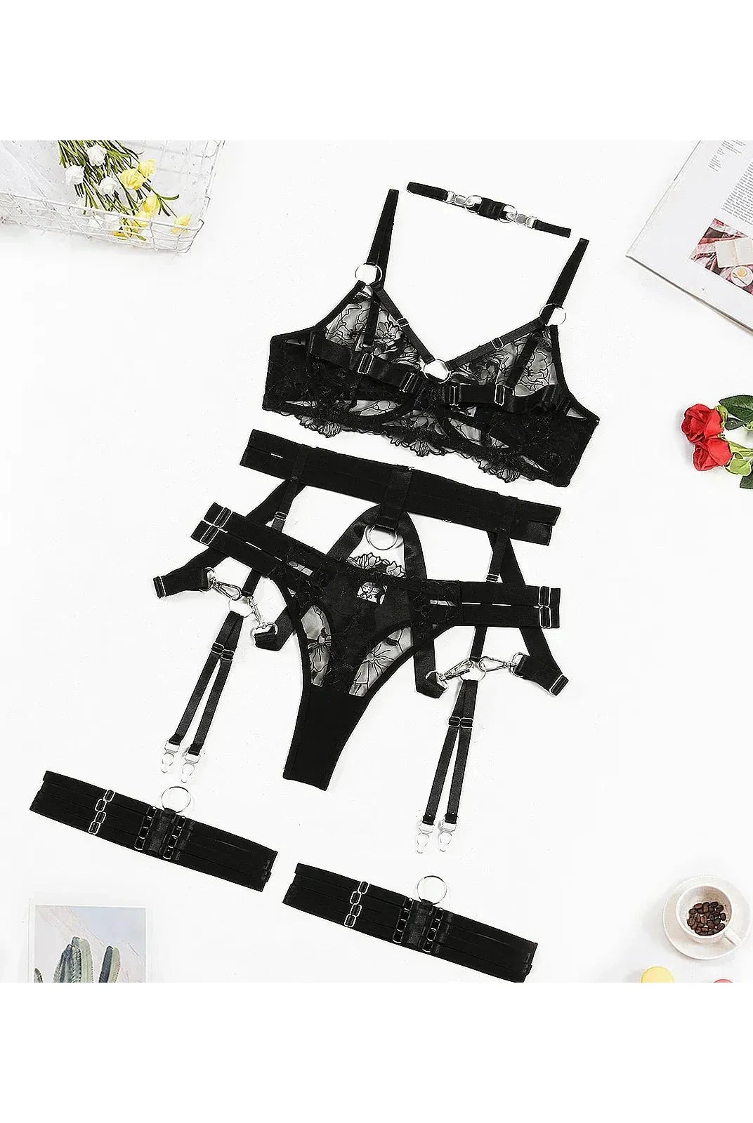 Black Zephyra 3-piece lingerie set by Lumina Vancouver featuring lace bras and matching panties on a flat lay.