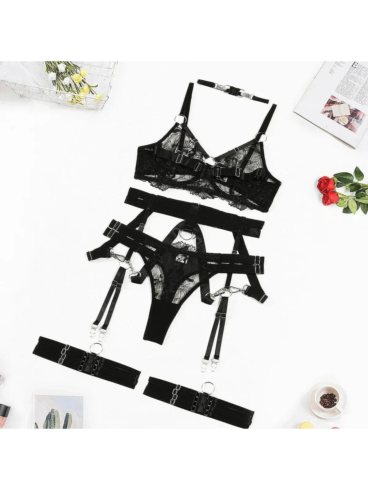 Black Zephyra 3-piece lingerie set by Lumina Vancouver featuring lace bras and matching panties on a flat lay.