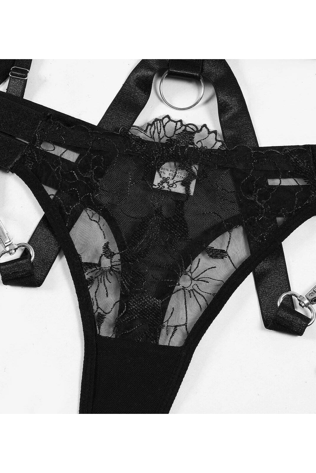 Black Zephyra 3-piece lingerie set by Lumina Vancouver, includes bra, panties, and garter belt, displayed on a mannequin.