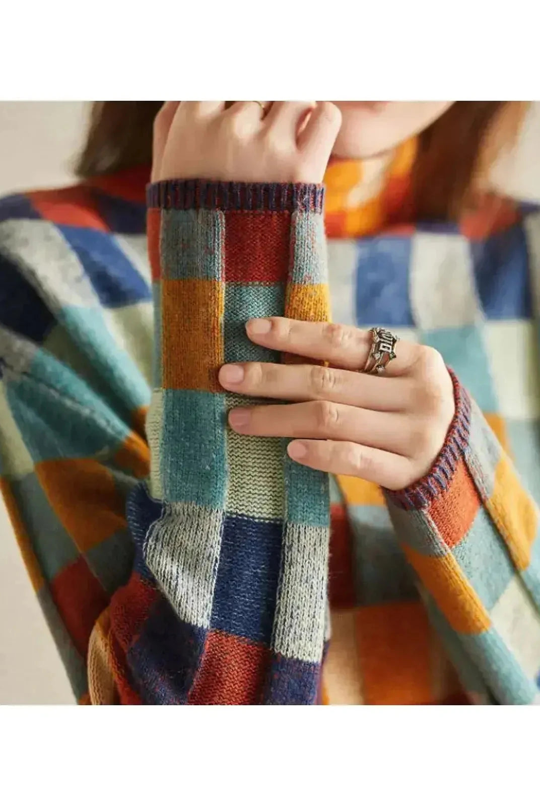 Lumina Wear Zuna sweater in cozy knit, featuring a relaxed fit and stylish design, displayed on a model.