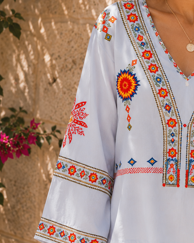 Lumina Wear Penelope bohemian embroidered summer blouse with V-neck and floral details, lightweight and stylish for warm weather.