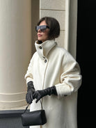 Elegant structured longline coat with high-neck design by Lumina Wear, featuring a sophisticated silhouette and tailored fit.