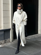 Elegant Lumina Wear Amaya longline coat with structured design and high-neck detail, stylish outerwear for sophisticated winter looks.