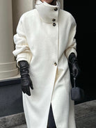 Elegant structured longline coat with high-neck design from Lumina Wear, featuring a tailored fit and sophisticated style.