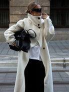 Elegant structured longline coat with high-neck design by Lumina Wear, featuring a tailored fit and sophisticated style.