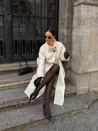 Lumina Wear Amaya longline coat with elegant structured design and high-neck style, perfect for sophisticated winter wear.