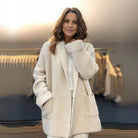 Lumina Wear Amelia cozy oversized knitted cardigan with an integrated scarf, featuring soft, warm, and stylish knit fabric.