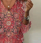 Audrey bohemian print summer blouse with flowing fit from Lumina Wear, featuring vibrant patterns and lightweight fabric.