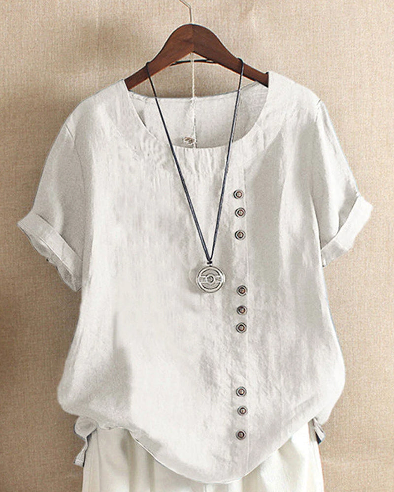 Light beige Beatrice summer blouse from Lumina Wear featuring relaxed fit and button details, displayed on a hanger.