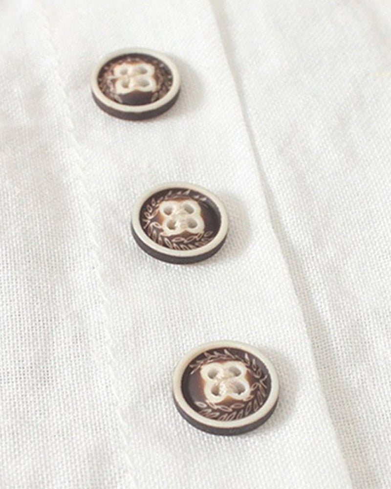 Light beige Lumina Wear Beatrice relaxed summer blouse with button detail, featuring a loose fit and breathable fabric.