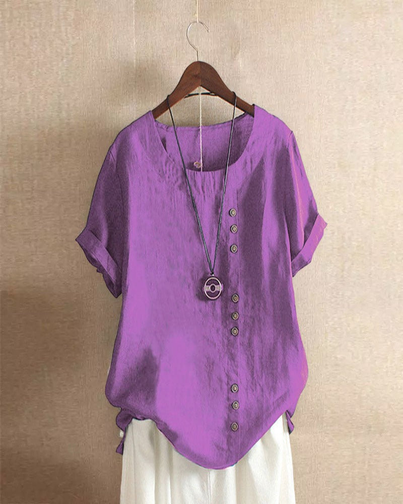 Light beige Beatrice summer blouse by Lumina Wear featuring relaxed fit and button details, displayed on a hanger.