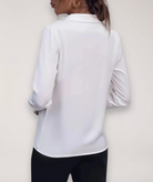 Elegant tailored white women's blouse by Lumina Wear featuring button-up front and classic collar, perfect for professional or casual wear.
