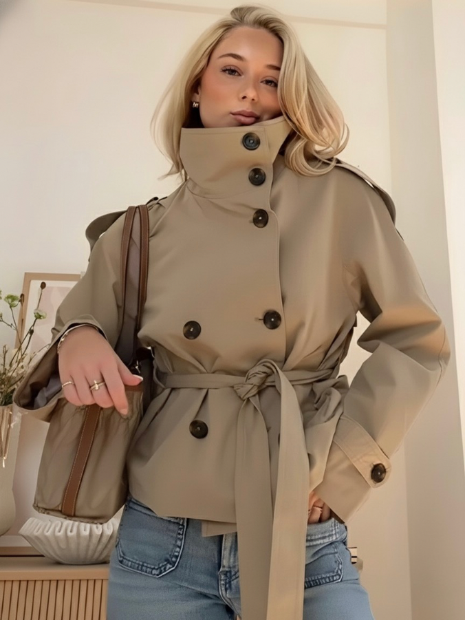 Light beige Cathryn Lumina women's short trench coat with belt and waist tie, structured design, suitable for stylish outerwear.