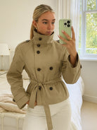 Lumina Wear Cathryn women's short trench coat with structured design, belt, and waist tie, perfect for stylish outerwear.