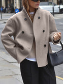 Black Charlene double-breasted peacoat with stand collar by Lumina Wear, showcasing tailored design and classic style.