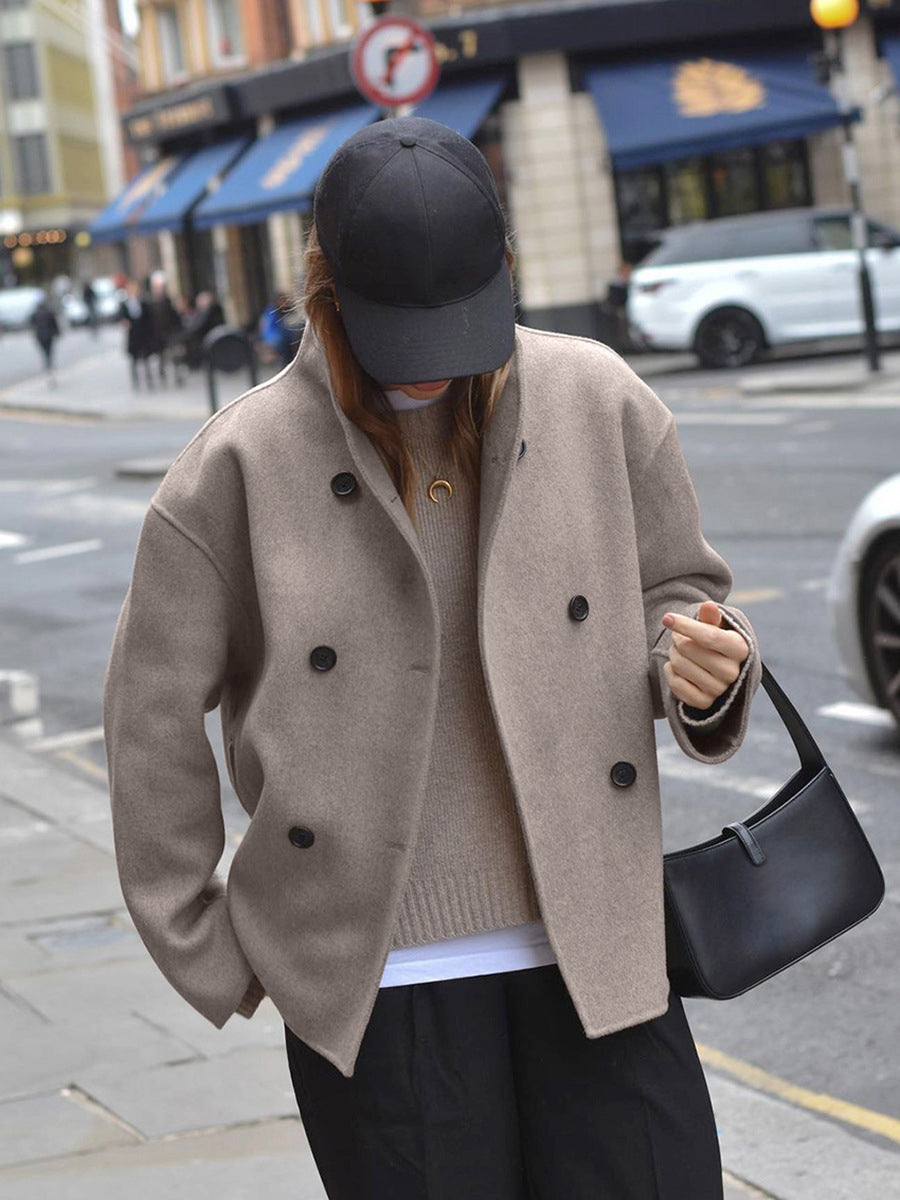 Black Charlene double-breasted peacoat with stand collar by Lumina Wear, showcasing classic style and tailored fit.