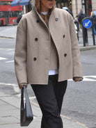 Charlen Lumina black double-breasted peacoat with stand collar, stylish outerwear for a sophisticated winter look.