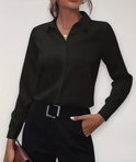 Elegant tailored Charlotte blouse by Lumina Wear featuring button details and a classic fit, styled on a hanger.