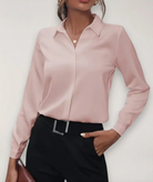 Elegant tailored Lumina Wear Charlotte blouse with button details, featuring a fitted design and classic collar.