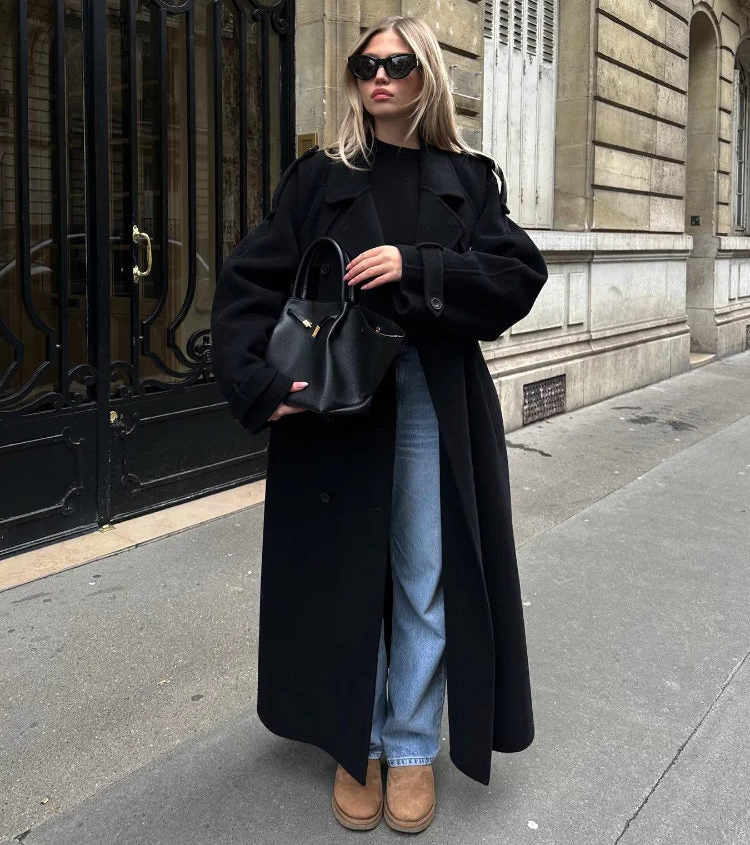 Black double-breasted trench coat with belted waist from Lumina Wear, featuring classic style and tailored fit.