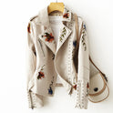 Leather jacket by Lumina Wear with floral embroidery, silver studs, edgy style, featuring detailed embroidery and metallic accents.
