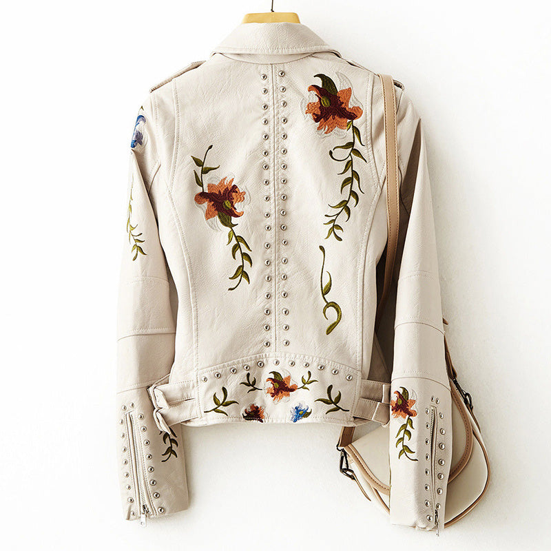 Women's leather jacket by Lumina Wear with edgy floral embroidery and silver studs, featuring a stylish and bold design.