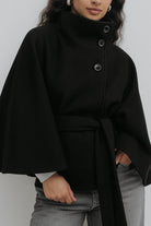 Elegant high-neck camel cape coat for women by Lumina Wear, showcasing a sophisticated design and tailored fit.