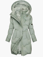 Lumina Wear Chloe elegant quilted hooded winter coat with tailored fit, showcasing its stylish design and cozy fabric.