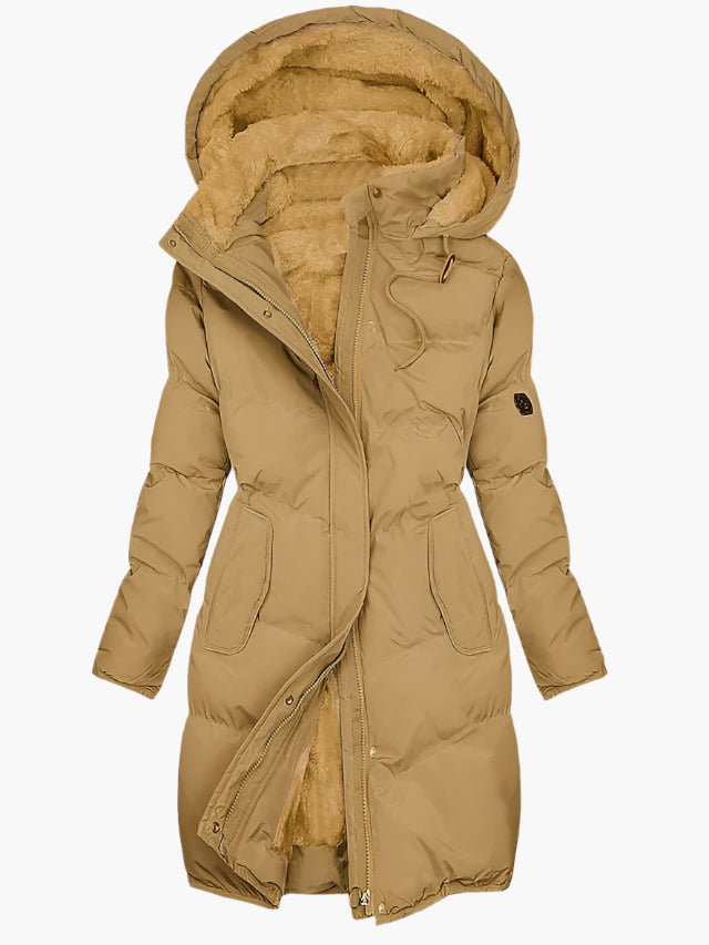 Women's quilted winter coat with hood and tailored fit by Lumina Wear, featuring elegant stitching and cozy design.