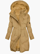 Women's quilted winter coat with hood and tailored fit by Lumina Wear, featuring elegant stitching and cozy design.