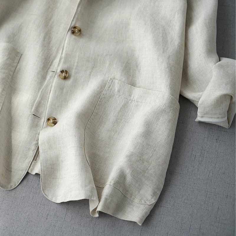 Women's linen blend blazer with structured lapel by Lumina Wear, relaxed fit, in neutral fabric, displayed on a hanger.