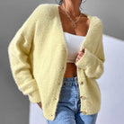 Light pink women's faux mink cardigan with button details from Lumina Wear, featuring a cozy, soft texture and relaxed fit.