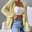Soft white Chloé cardigan sweater with button details, styled by Lumina Wear, featuring a cozy and elegant women's cardigan.