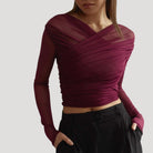 Lumina Wear Claire elegant sheer wrap top featuring a flattering fit, styled with long sleeves and a stylish neckline.