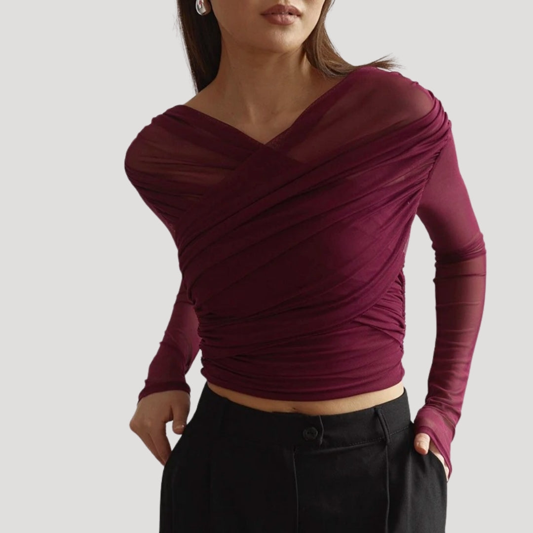 Elegant sheer wrap blouse by Lumina Wear featuring a flattering fit, styled with long sleeves and a sophisticated design.