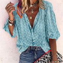 Brightly printed Lumina Wear Claire casual blouse with button front, featuring vibrant floral pattern and relaxed fit.