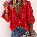 Brightly printed Lumina Wear Claire casual blouse with button front, featuring vibrant floral patterns and a relaxed fit.