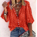 Brightly printed casual blouse by Lumina Wear featuring a button front and vibrant floral design, perfect for everyday wear.